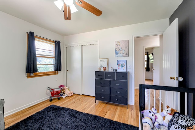 4509 Ridgeway Rd, Omaha, NE 68134 - bedroom featuring light wood-style flooring, ceiling fan, and a closet