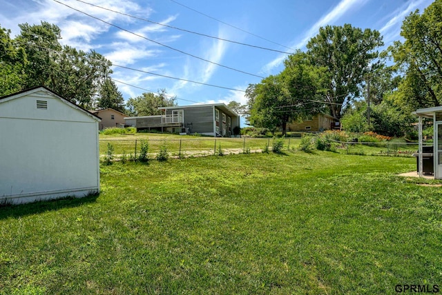 4509 Ridgeway Rd, Omaha, NE 68134 - fenced backyard featuring a storage unit