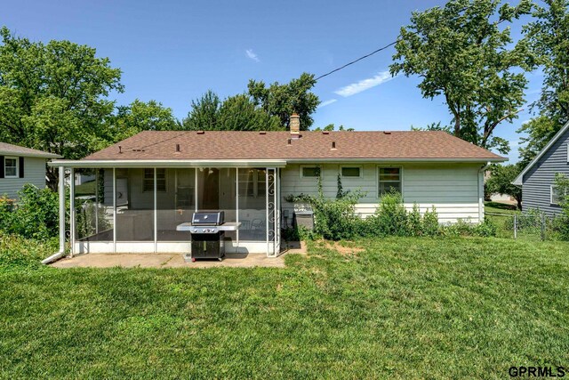4509 Ridgeway Rd, Omaha, NE 68134 - back of house with a sunroom, a chimney, and a shingled roof