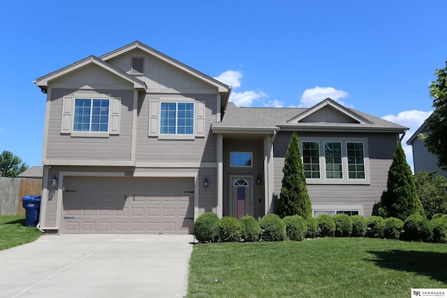 13719 S 43rd Ave, Bellevue, NE 68123 - view of front of home with a garage, driveway, a front lawn, and a shingled roof