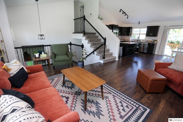 13719 S 43rd Ave, Bellevue, NE 68123 - living room featuring dark wood-type flooring, high vaulted ceiling, track lighting, and stairs