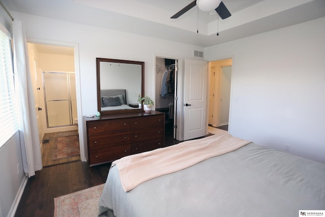13719 S 43rd Ave, Bellevue, NE 68123 - bedroom with dark wood-style floors, connected bathroom, a closet, a spacious closet, and ceiling fan