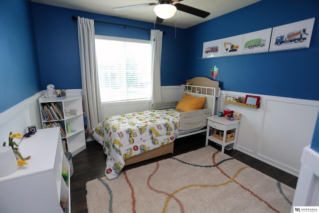 13719 S 43rd Ave, Bellevue, NE 68123 - bedroom with wainscoting, wood finished floors, a decorative wall, and a ceiling fan
