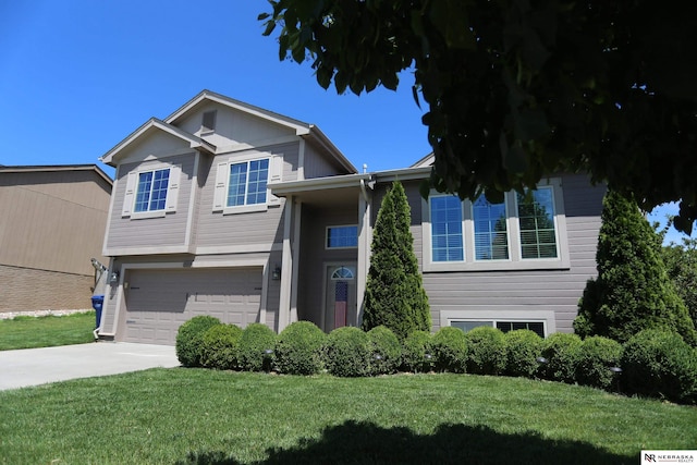 13719 S 43rd Ave, Bellevue, NE 68123 - view of front of house featuring an attached garage, a front yard, and driveway