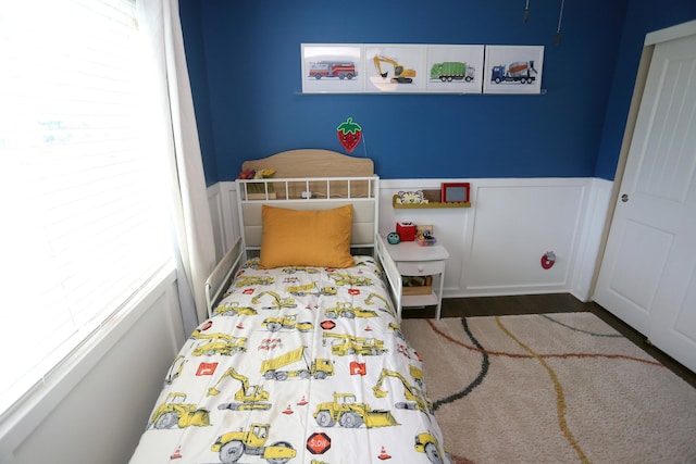 13719 S 43rd Ave, Bellevue, NE 68123 - bedroom featuring multiple windows and wood finished floors