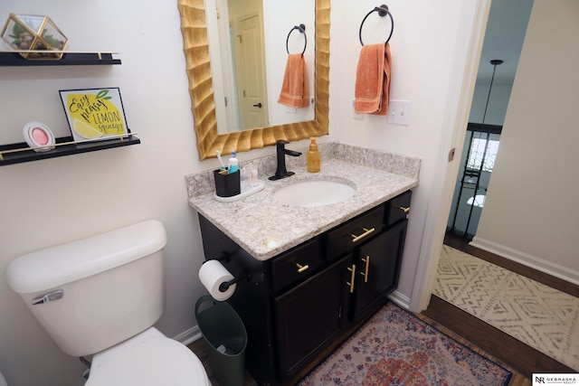 13719 S 43rd Ave, Bellevue, NE 68123 - bathroom featuring vanity and wood finished floors