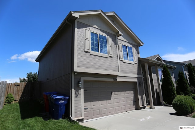 13719 S 43rd Ave, Bellevue, NE 68123 - view of home's exterior featuring a garage and concrete driveway