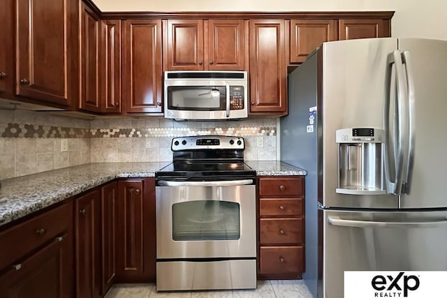 2611 N 189th St, Elkhorn, NE 68022 - kitchen with stainless steel appliances, backsplash, and light stone countertops
