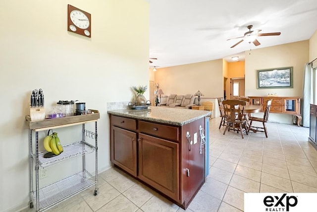 2611 N 189th St, Elkhorn, NE 68022 - kitchen featuring ceiling fan, light tile patterned floors, a peninsula, and open floor plan