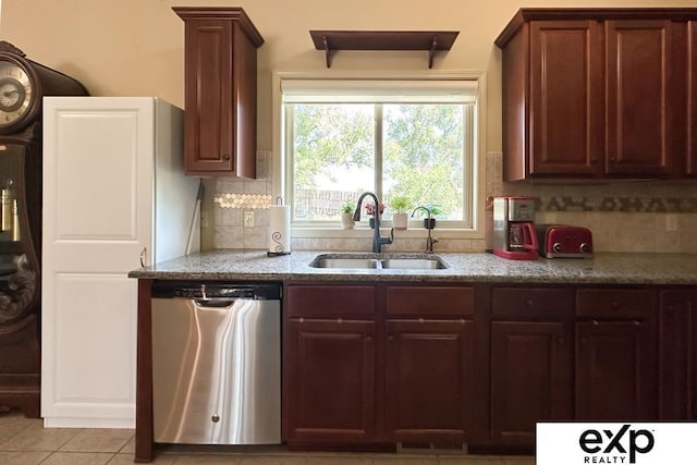 2611 N 189th St, Elkhorn, NE 68022 - kitchen featuring dishwasher, tasteful backsplash, light stone countertops, and light tile patterned floors