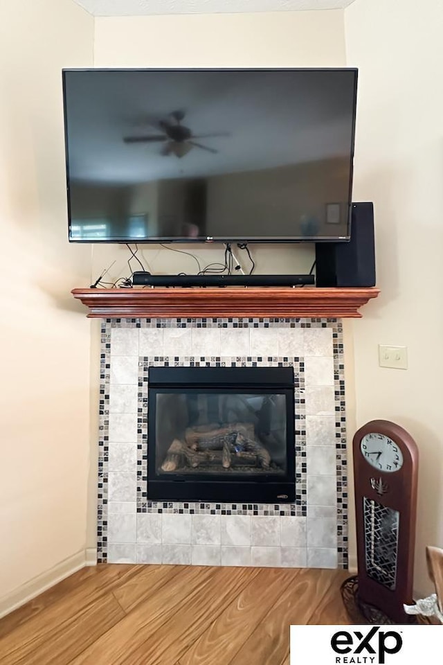 2611 N 189th St, Elkhorn, NE 68022 - detailed view of ceiling fan, wood finished floors, and a tile fireplace