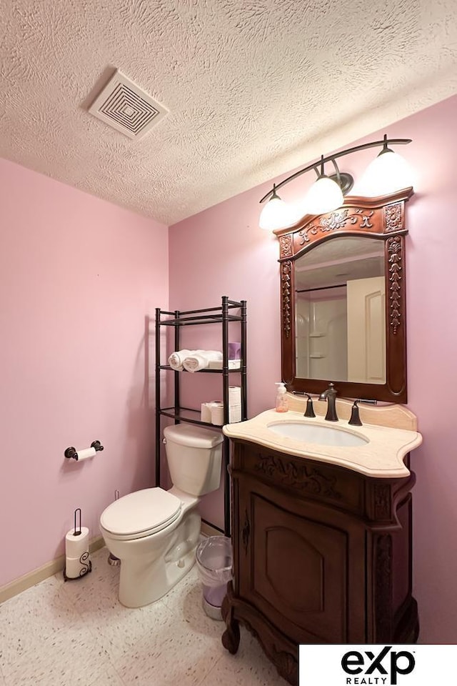 2611 N 189th St, Elkhorn, NE 68022 - half bathroom with vanity, a textured ceiling, and speckled floor