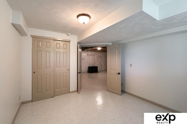 2611 N 189th St, Elkhorn, NE 68022 - finished below grade area featuring a textured ceiling and baseboards