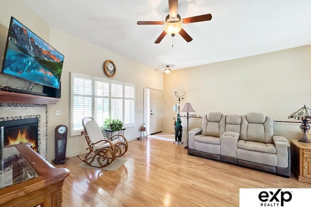 2611 N 189th St, Elkhorn, NE 68022 - living room featuring light wood finished floors, ceiling fan, and a tiled fireplace