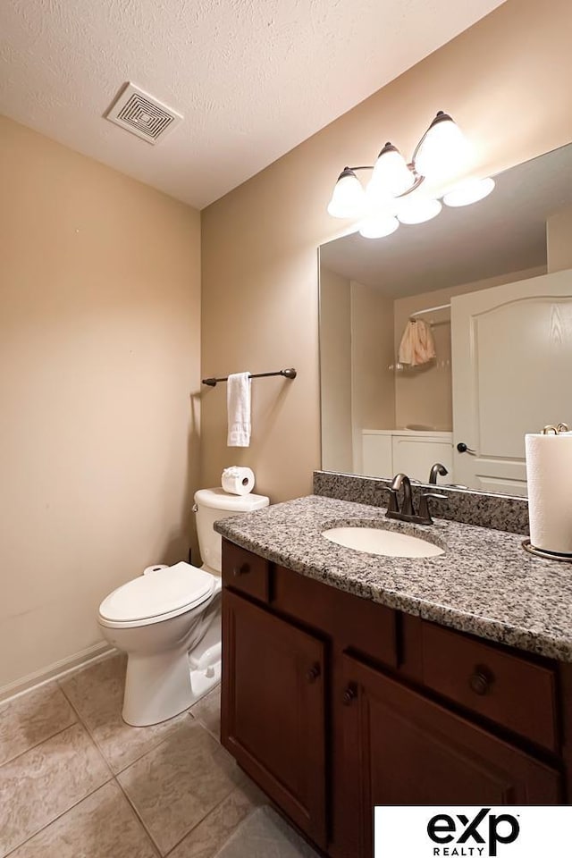 2611 N 189th St, Elkhorn, NE 68022 - bathroom featuring vanity, tile patterned flooring, and a textured ceiling
