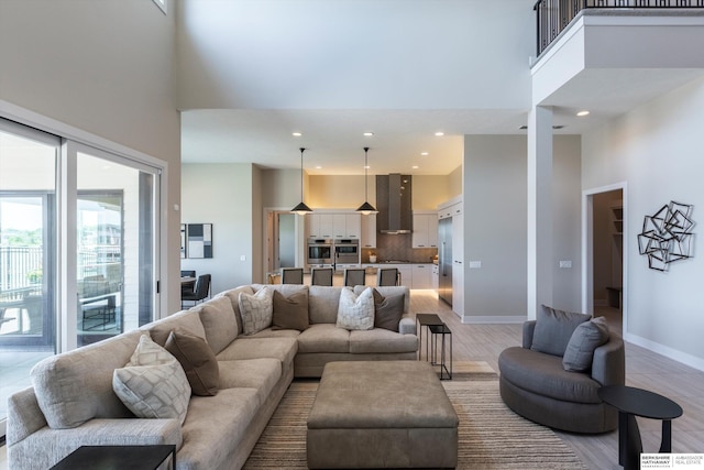 6217 N 295th St, Valley, NE 68064 - living room with a towering ceiling, recessed lighting, and light wood-style flooring