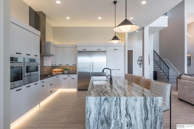 6217 N 295th St, Valley, NE 68064 - kitchen featuring modern cabinets, appliances with stainless steel finishes, tasteful backsplash, white cabinetry, and recessed lighting