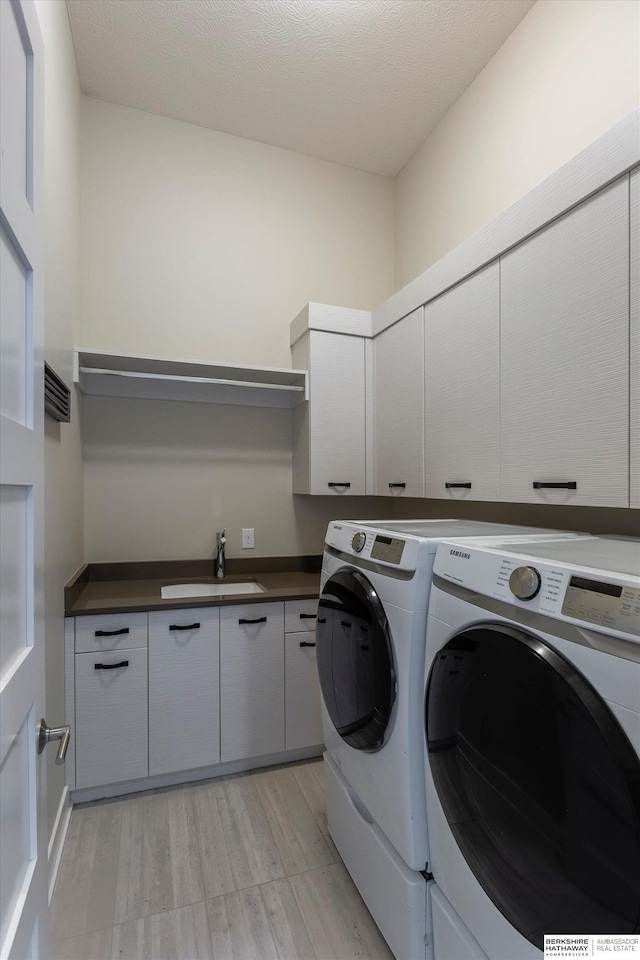 6217 N 295th St, Valley, NE 68064 - laundry area with cabinet space and washing machine and dryer