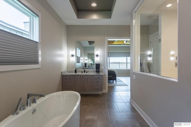 6217 N 295th St, Valley, NE 68064 - bathroom featuring a soaking tub, vanity, a ceiling fan, recessed lighting, and tile patterned flooring