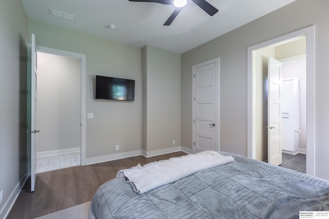 6217 N 295th St, Valley, NE 68064 - bedroom featuring wood finished floors, a ceiling fan, and ensuite bath