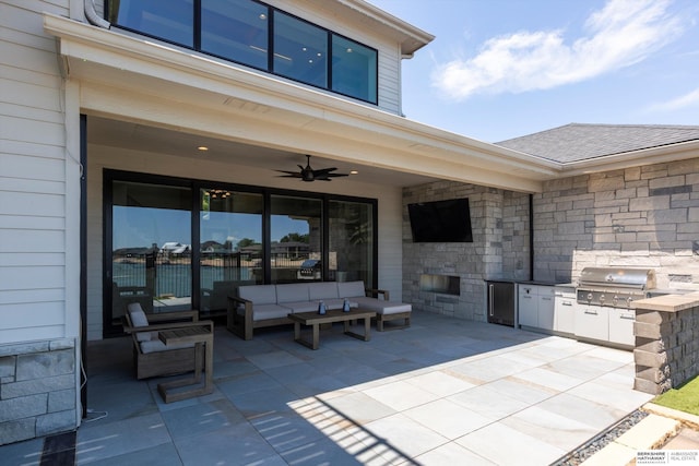 6217 N 295th St, Valley, NE 68064 - view of patio with an outdoor kitchen, ceiling fan, and an outdoor living space with a fireplace
