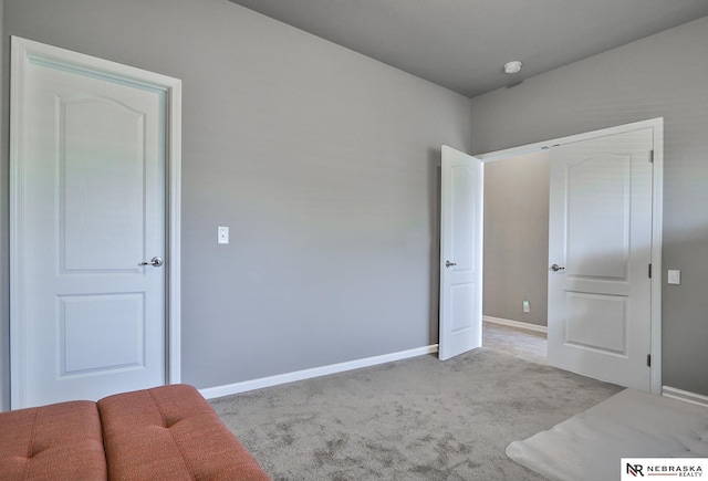 17457 Ames Ave, Omaha, NE 68116 - unfurnished bedroom featuring light colored carpet and baseboards