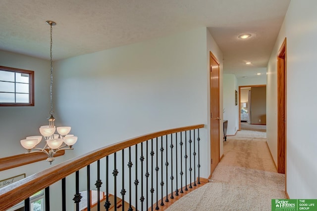19311 Josephine St, Gretna, NE 68028 - corridor with light carpet, a chandelier, plenty of natural light, recessed lighting, and an upstairs landing