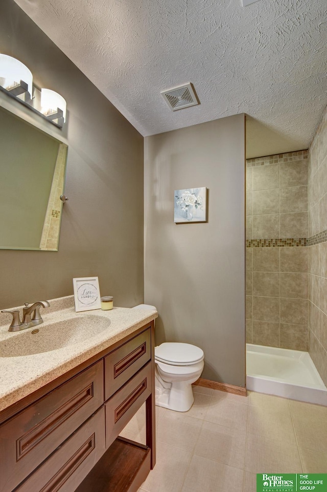 19311 Josephine St, Gretna, NE 68028 - bathroom with vanity, tiled shower, and a textured ceiling