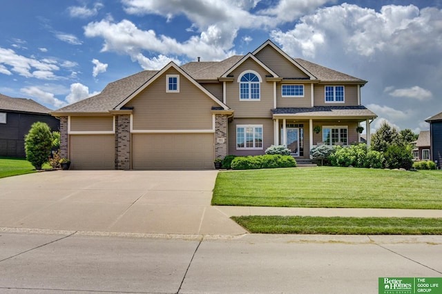 19311 Josephine St, Gretna, NE 68028 - craftsman-style house featuring concrete driveway, an attached garage, a front lawn, and covered porch
