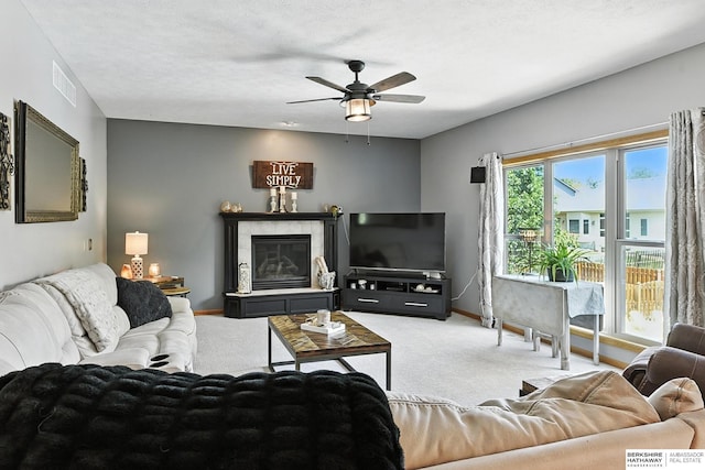 8127 S 105th St, La Vista, NE 68128 - carpeted living area featuring ceiling fan and baseboards