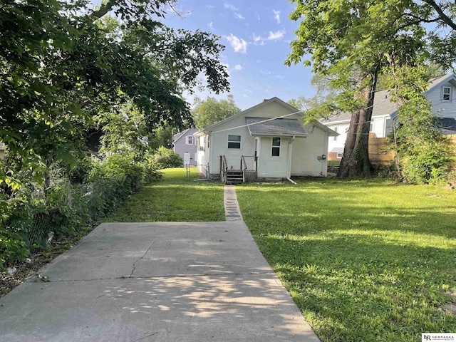 4317 Emmet St, Omaha, NE 68111 - rear view of property featuring a yard