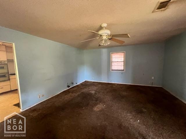 1508 N Easy St, Jonesboro, AR 72401 - carpeted empty room with ceiling fan and a textured ceiling