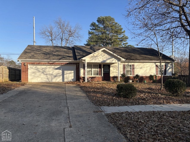 ranch-style home with an attached garage, driveway, fence, and brick siding