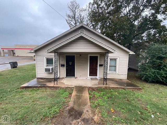 1727 S Church St S, Jonesboro, AR 72401 - bungalow featuring cooling unit, a patio area, and a front yard