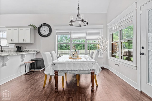 5301 Bridger Park Ct, Jonesboro, AR 72405 - dining room featuring a chandelier, plenty of natural light, and dark wood-type flooring