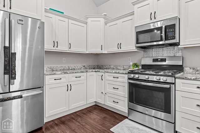 5301 Bridger Park Ct, Jonesboro, AR 72405 - kitchen with appliances with stainless steel finishes, dark wood-type flooring, white cabinetry, and light stone counters