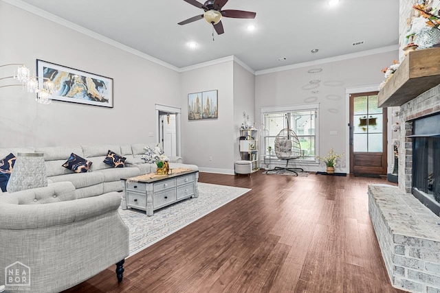 5301 Bridger Park Ct, Jonesboro, AR 72405 - living area with a fireplace, ceiling fan, dark wood finished floors, recessed lighting, and ornamental molding