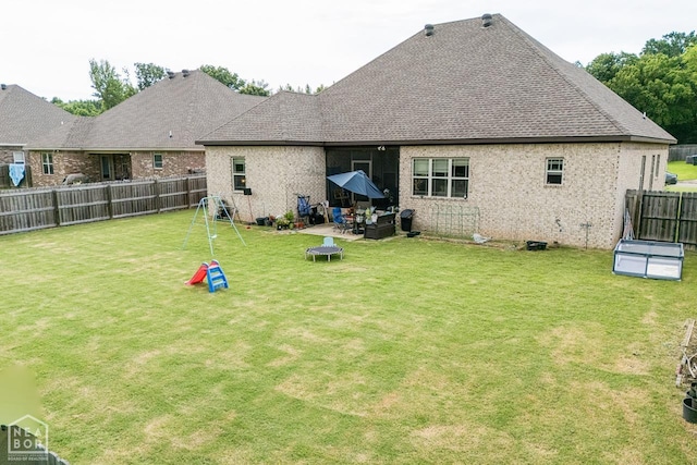 5301 Bridger Park Ct, Jonesboro, AR 72405 - rear view of house featuring a fenced backyard and roof with shingles