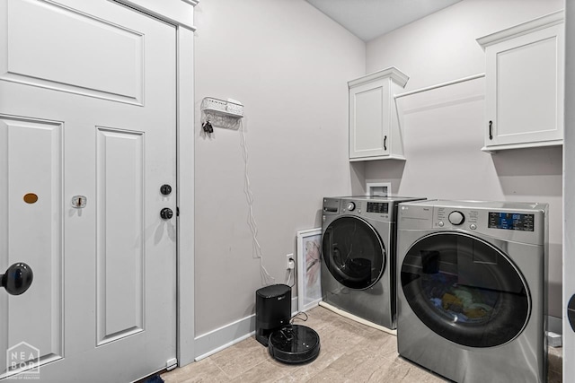 5301 Bridger Park Ct, Jonesboro, AR 72405 - laundry room featuring cabinet space and washer and clothes dryer