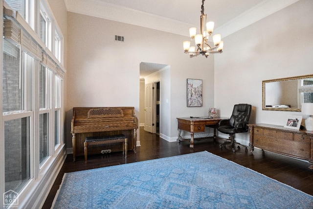 office area with baseboards, an inviting chandelier, ornamental molding, visible vents, and hardwood / wood-style floors