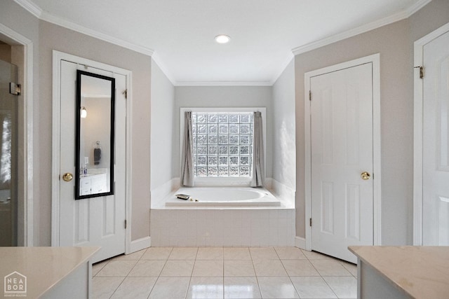 bathroom with tile patterned flooring, vanity, a bath, and ornamental molding