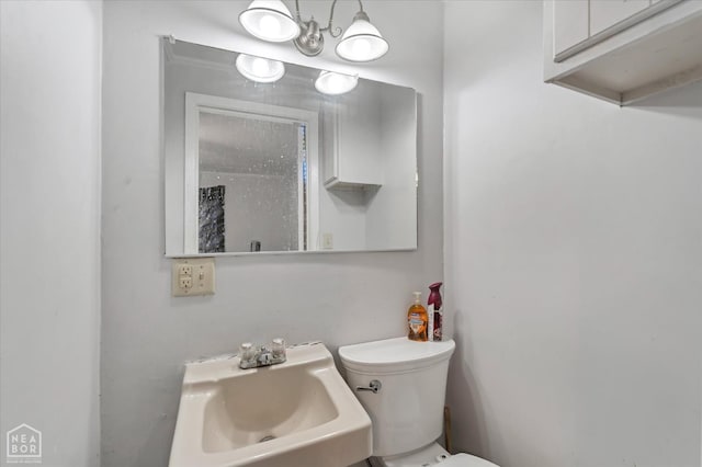 half bathroom with a sink and toilet