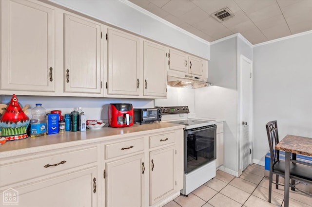 kitchen with under cabinet range hood, ornamental molding, white range with electric stovetop, light tile patterned flooring, and visible vents