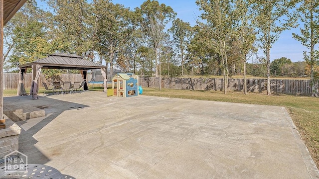5200 Julia Cv, Jonesboro, AR 72404 - back of property with fence, roof with shingles, a sunroom, a patio area, and a gazebo