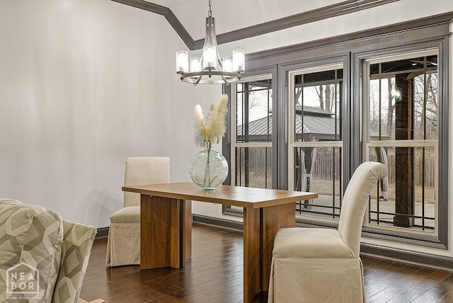 5200 Julia Cv, Jonesboro, AR 72404 - dining space with crown molding, a chandelier, and dark wood-style floors