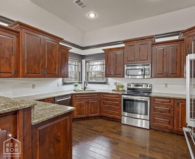 5200 Julia Cv, Jonesboro, AR 72404 - kitchen with light stone countertops, appliances with stainless steel finishes, and a sink