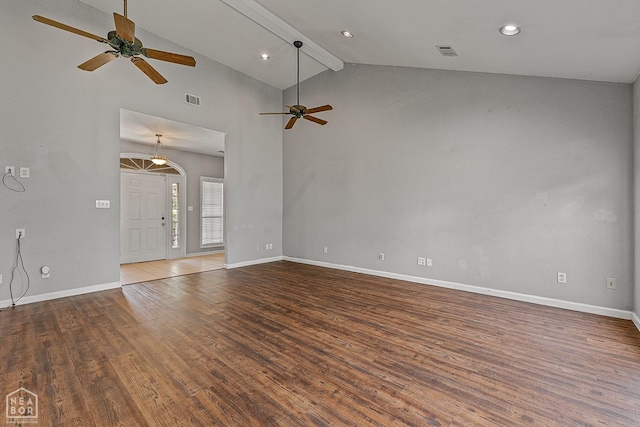 unfurnished living room with visible vents, ceiling fan, wood finished floors, and baseboards