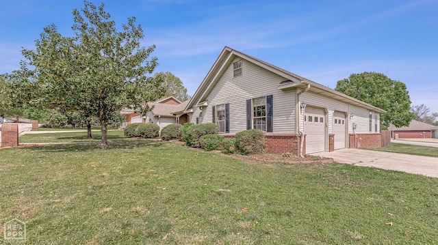 view of side of home featuring a yard, brick siding, driveway, and an attached garage