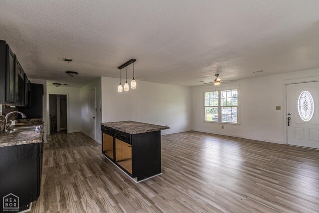 2303 E Lake St E, Paragould, AR 72450 - bathroom with toilet, vanity, and tasteful backsplash