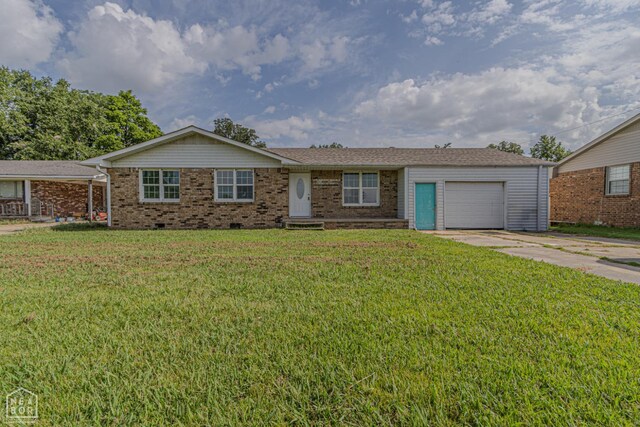 2303 E Lake St E, Paragould, AR 72450 - ranch-style house with a garage, concrete driveway, brick siding, a front lawn, and crawl space